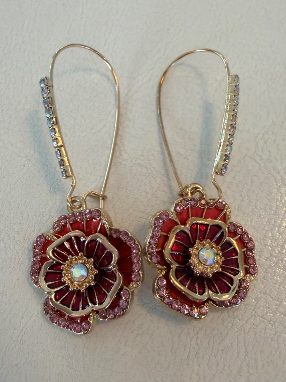 Betsey Johnson gold tone with red floral rhinestone drop earrings.